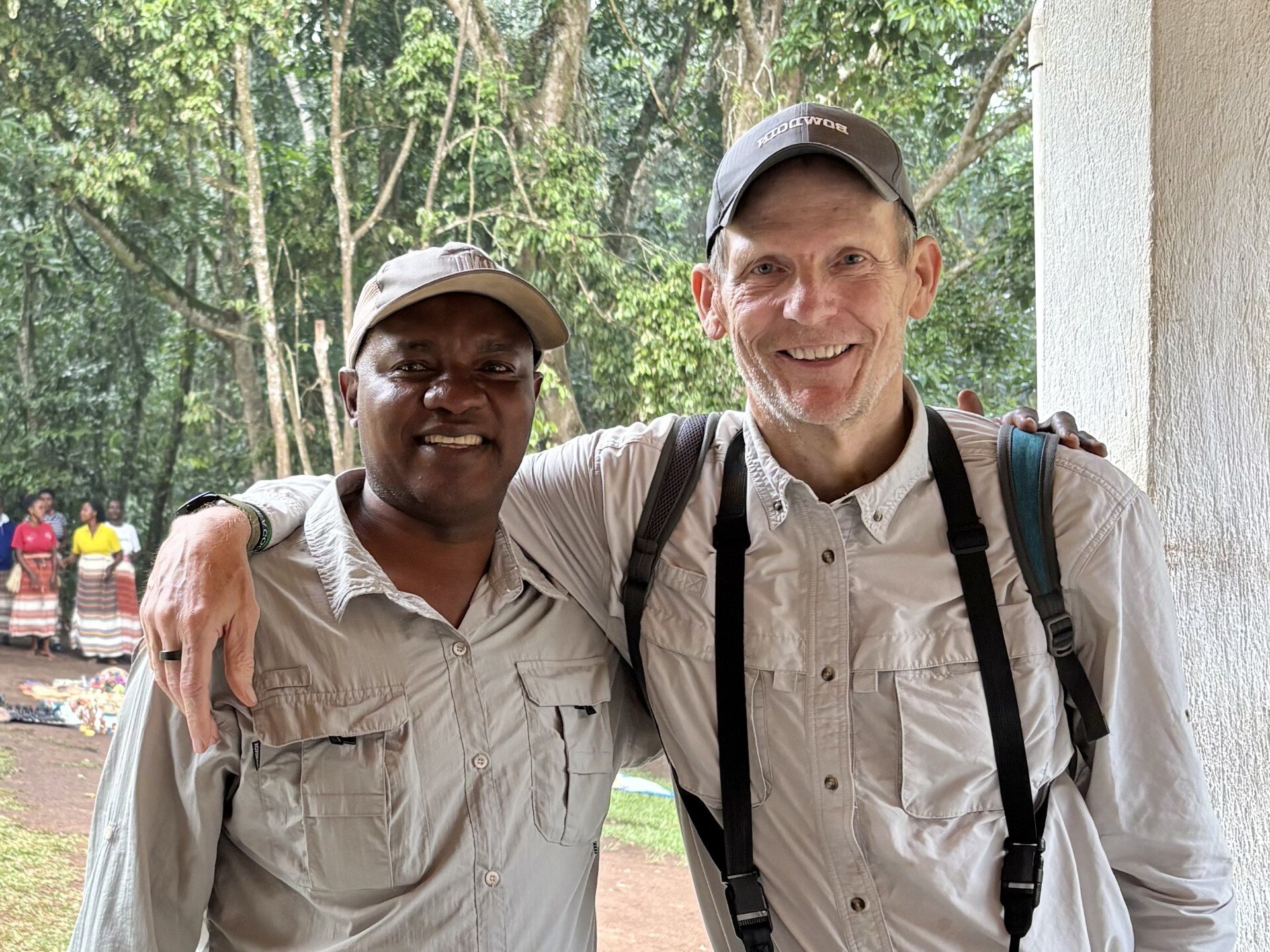 Sam Kamugisha (left) and Dan Spears (right) together outdoors in East Africa